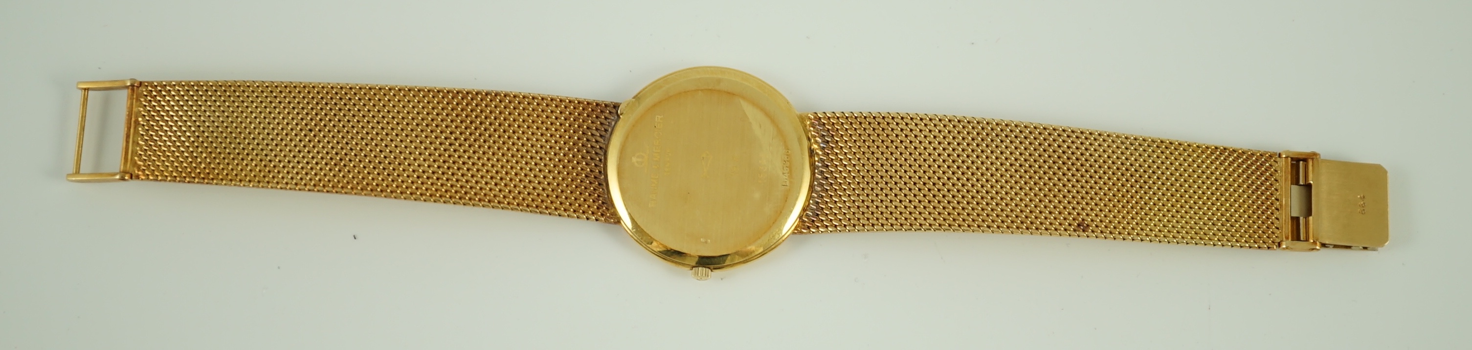 A gentleman's 1980's 18k gold Baume & Mercier quartz dress wrist watch, on a Baume & Mercier 18k gold bracelet